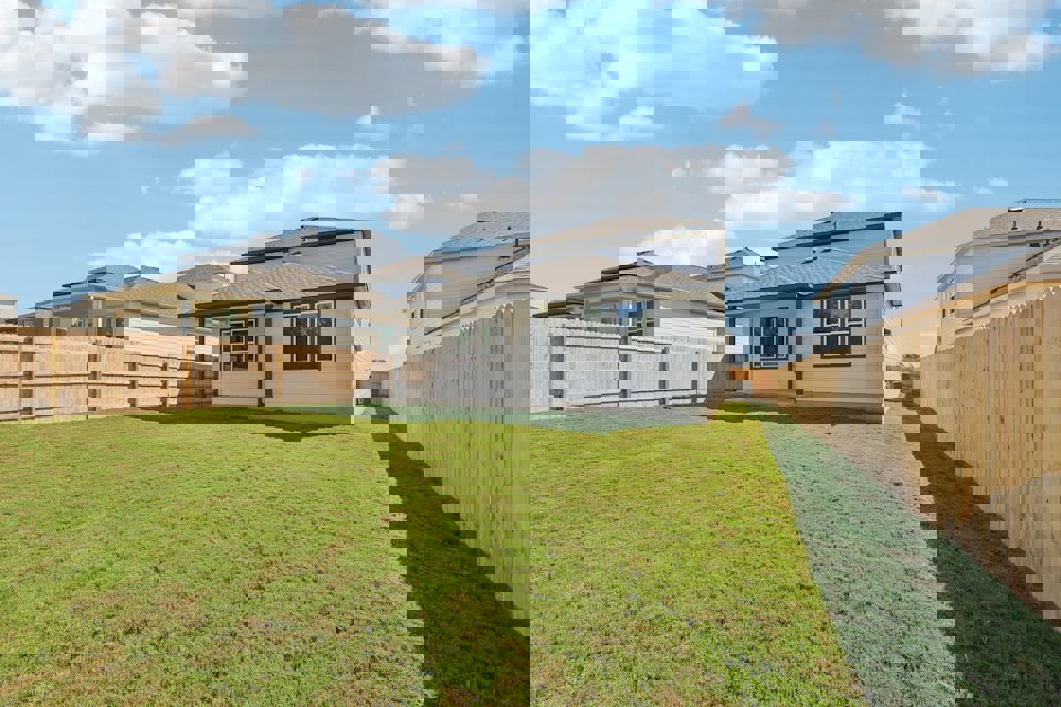 A house with a fence around it.