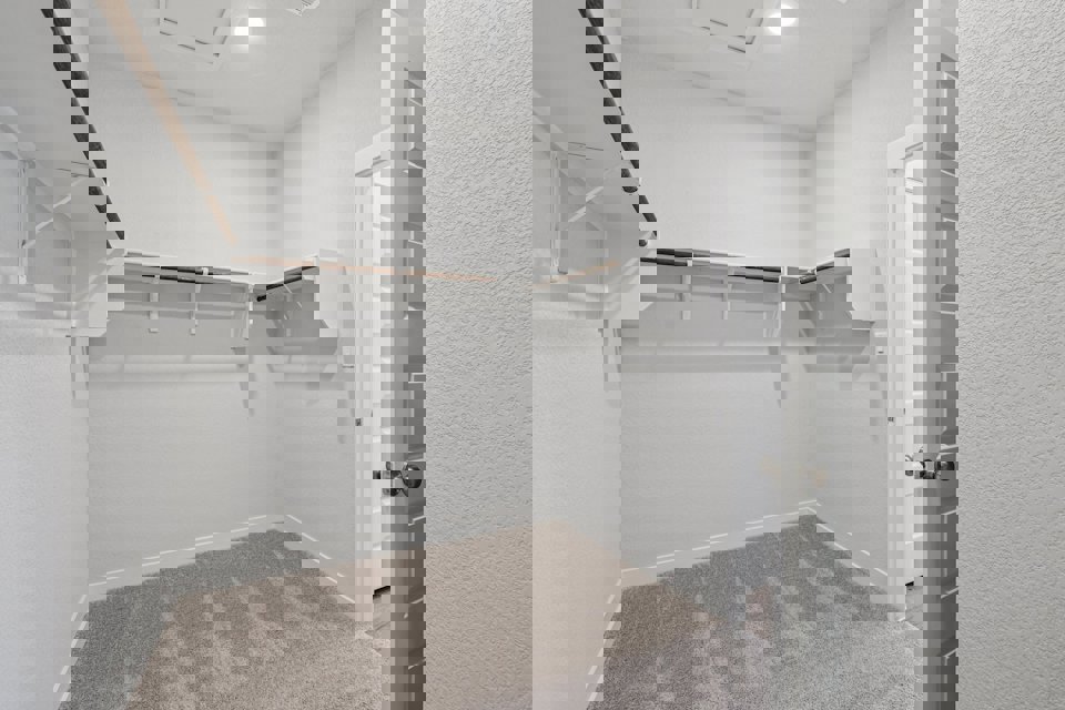 A bathroom with white walls.