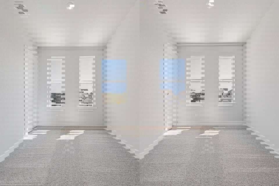 A room with a window and a door.