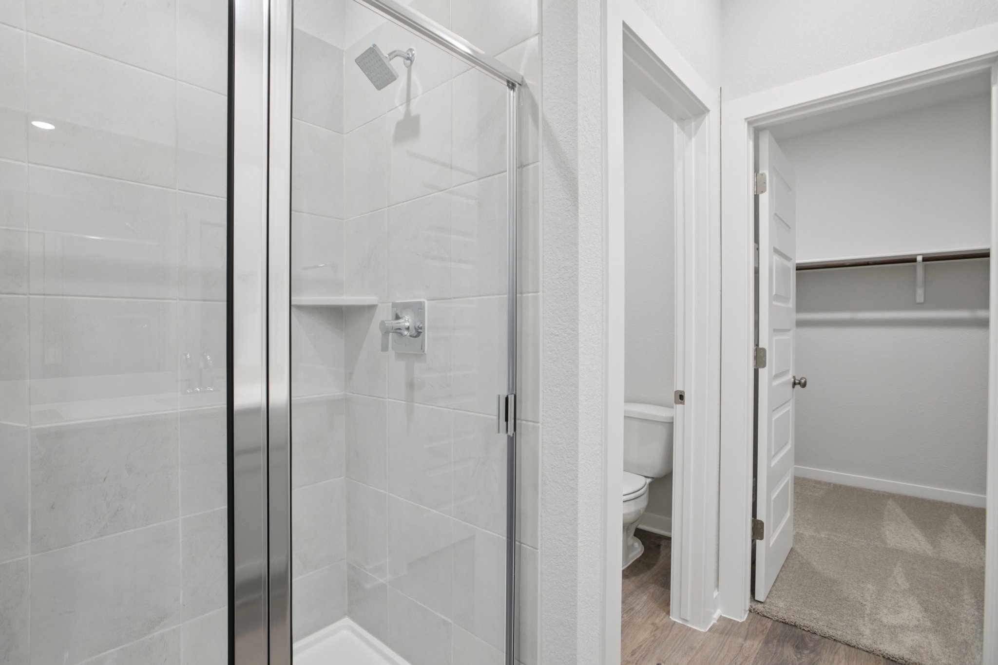 A bathroom with a glass shower.