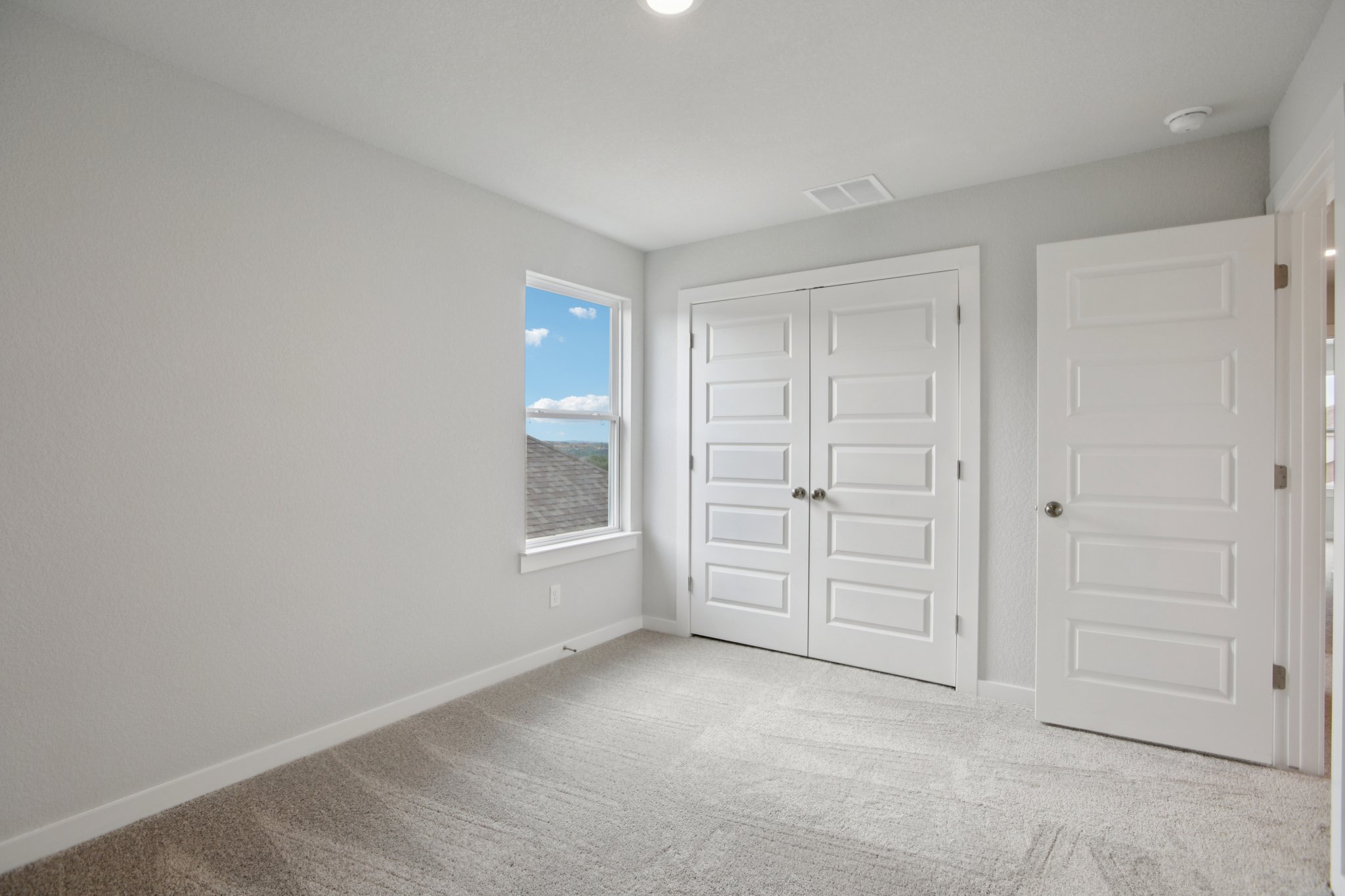 A room with white doors.