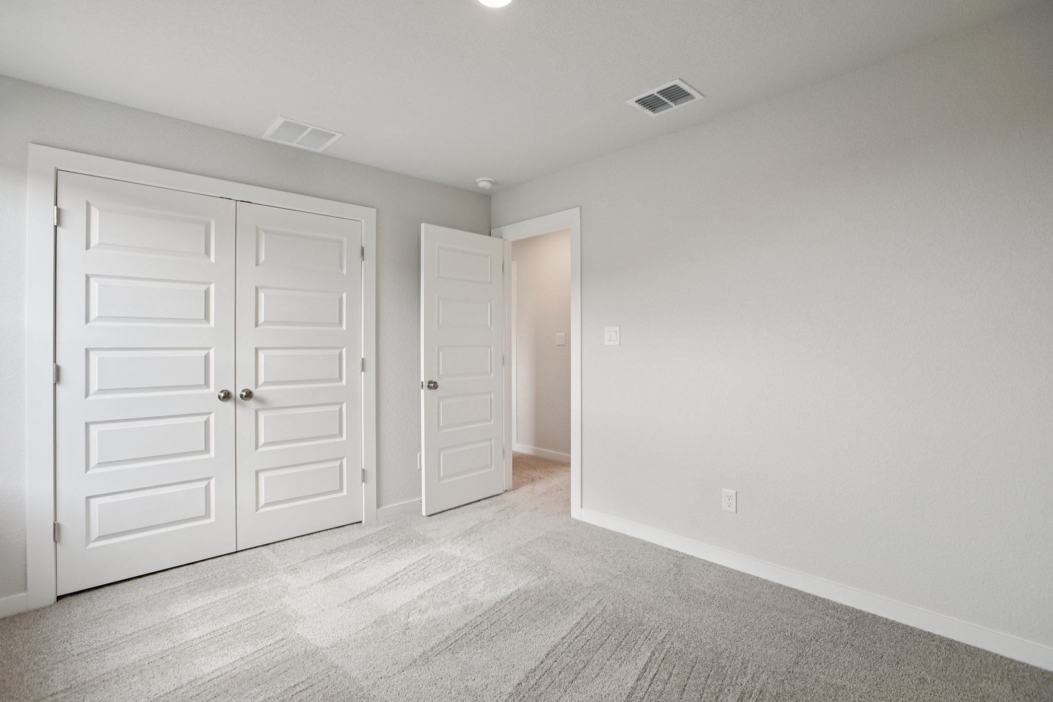 A room with white doors.