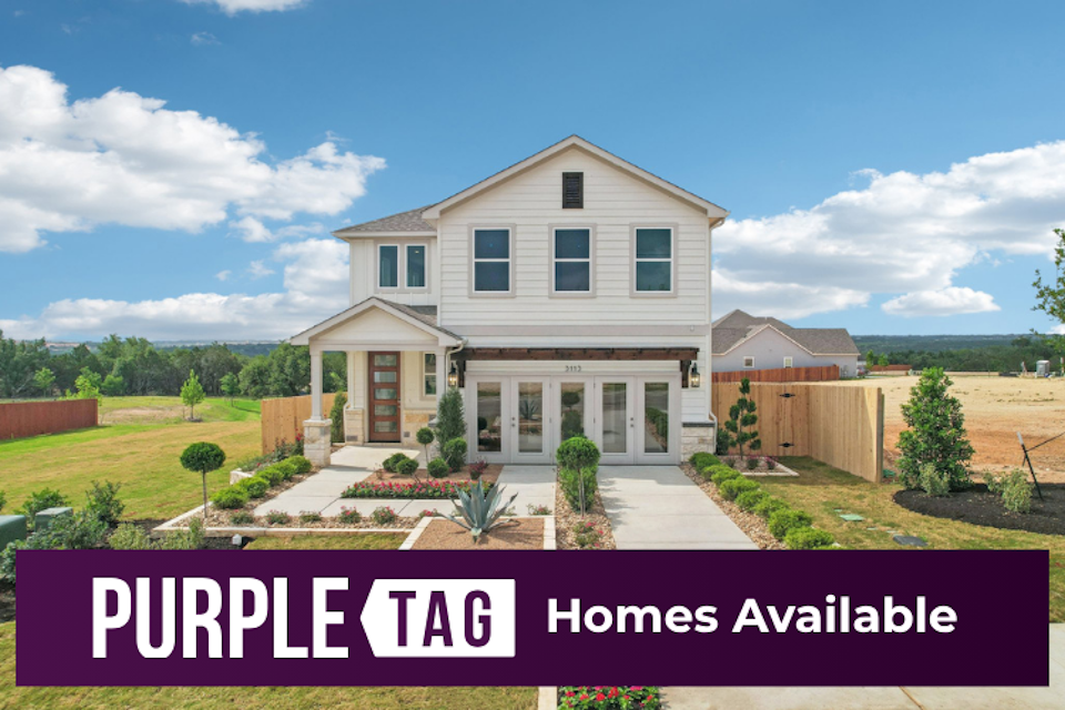 A house with a fence and trees.