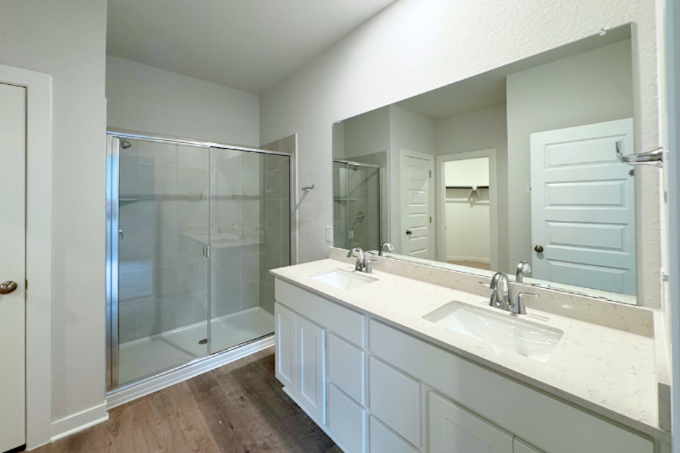 A bathroom with a glass shower.