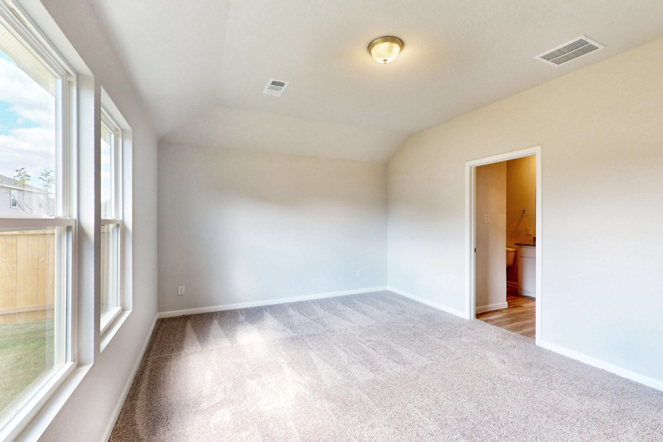 A long hallway with white walls.