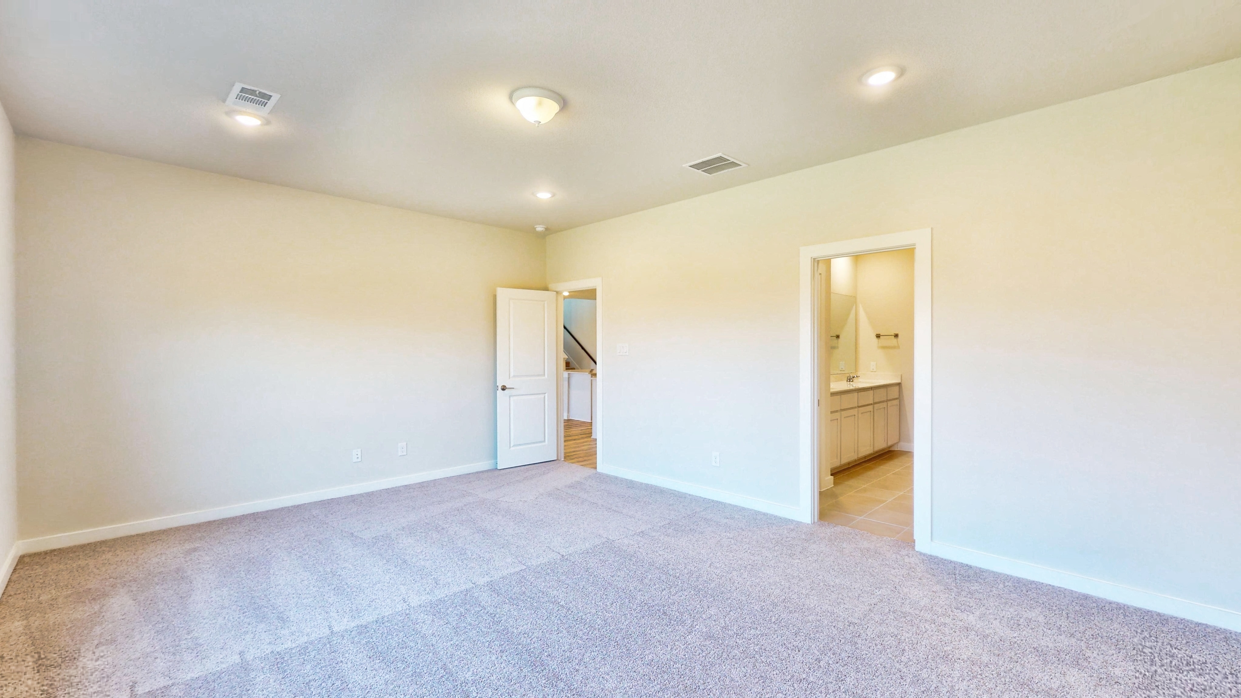 A room with a carpet and a blue carpet.