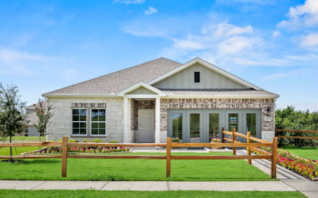 A house with a fence in front.