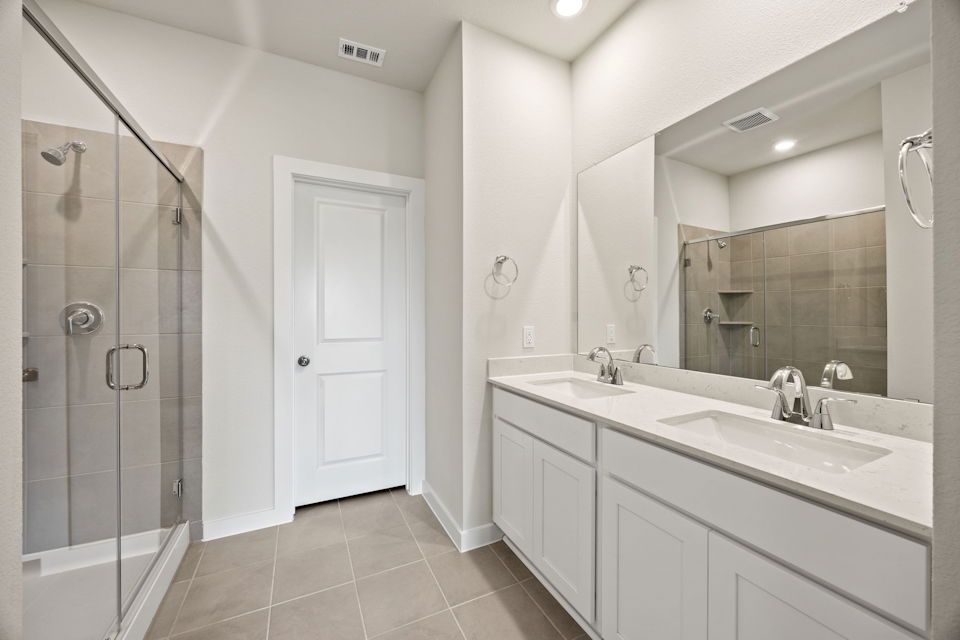 A bathroom with a glass shower.