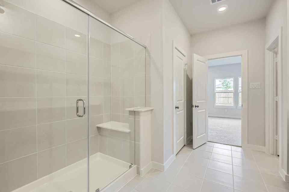 A bathroom with a glass shower.