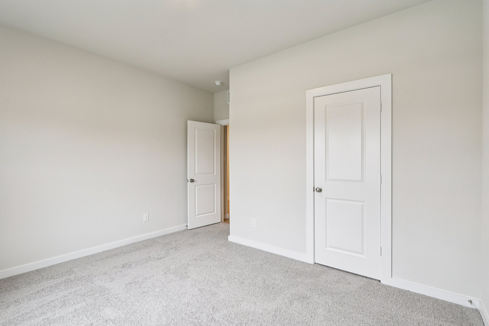 A room with white doors.