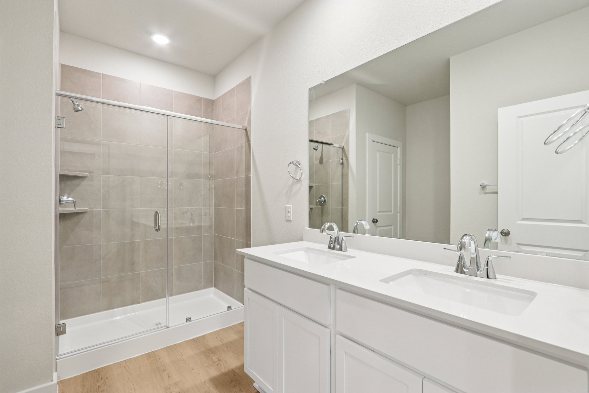 A bathroom with a glass shower.
