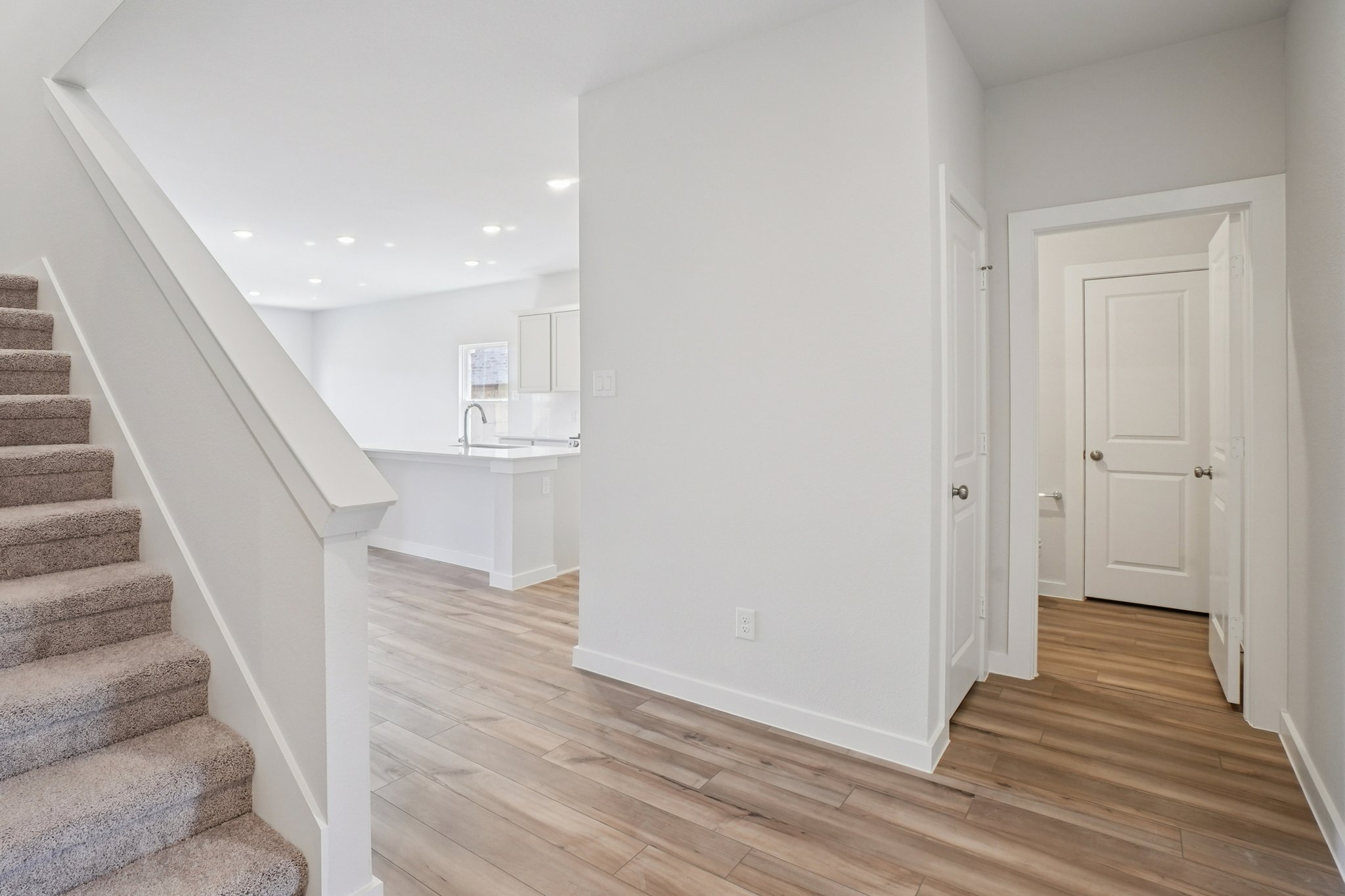 A staircase leading to a bathroom.