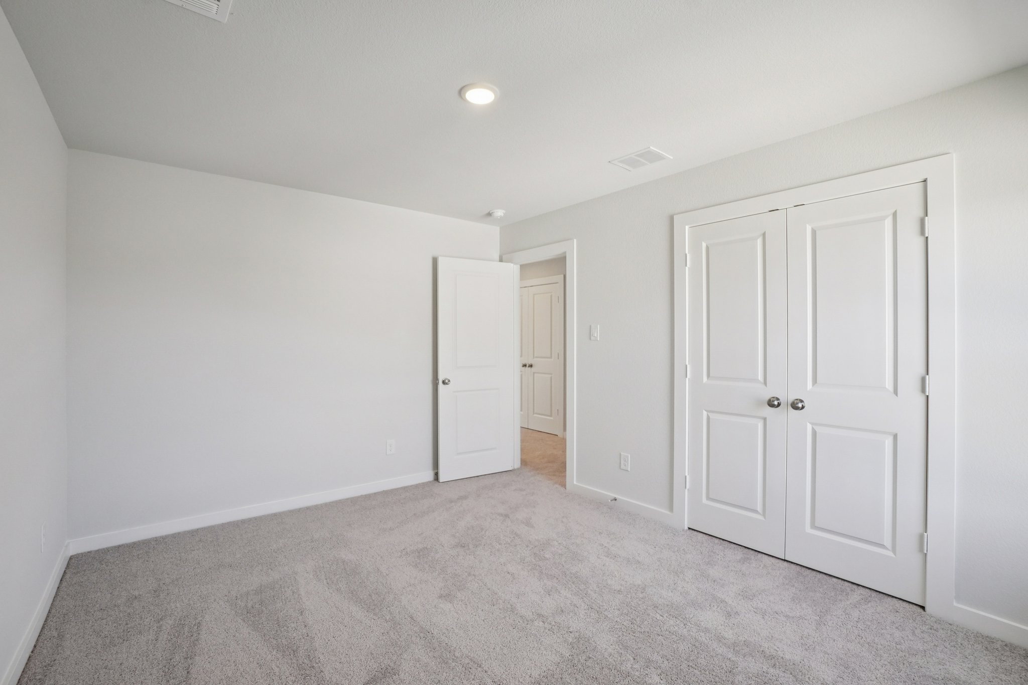 A room with white doors.