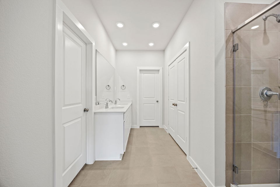 A bathroom with a glass shower.