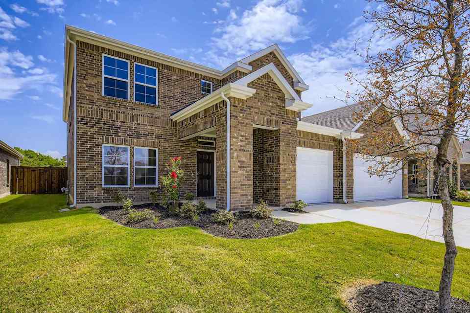 A house with a large front yard.