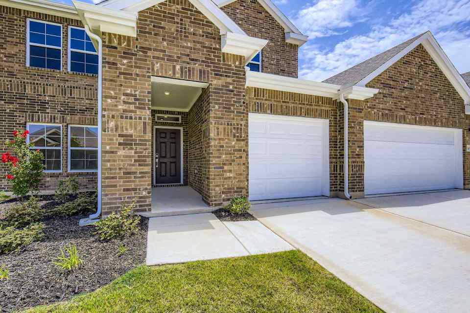 A brick building with garages.