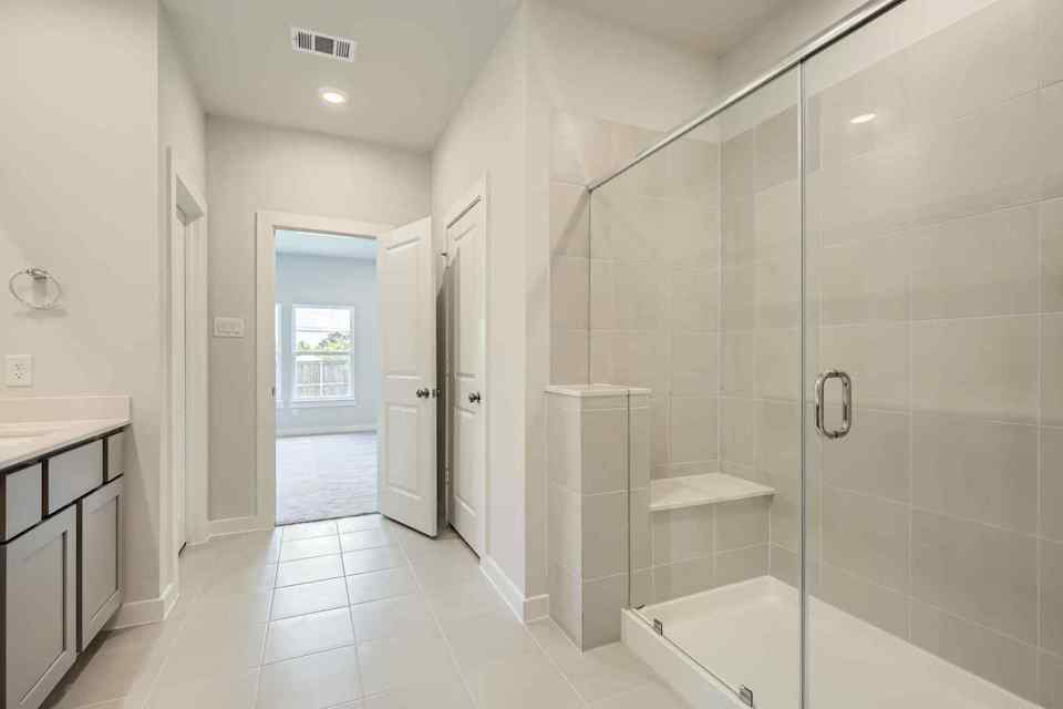 A bathroom with a glass shower.