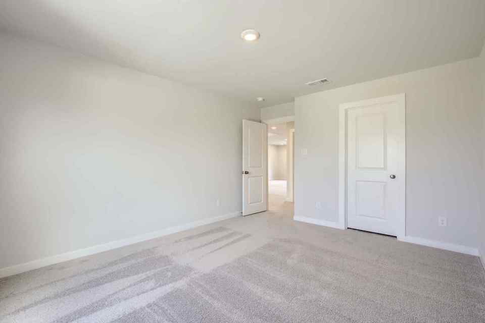 A hallway with white doors.