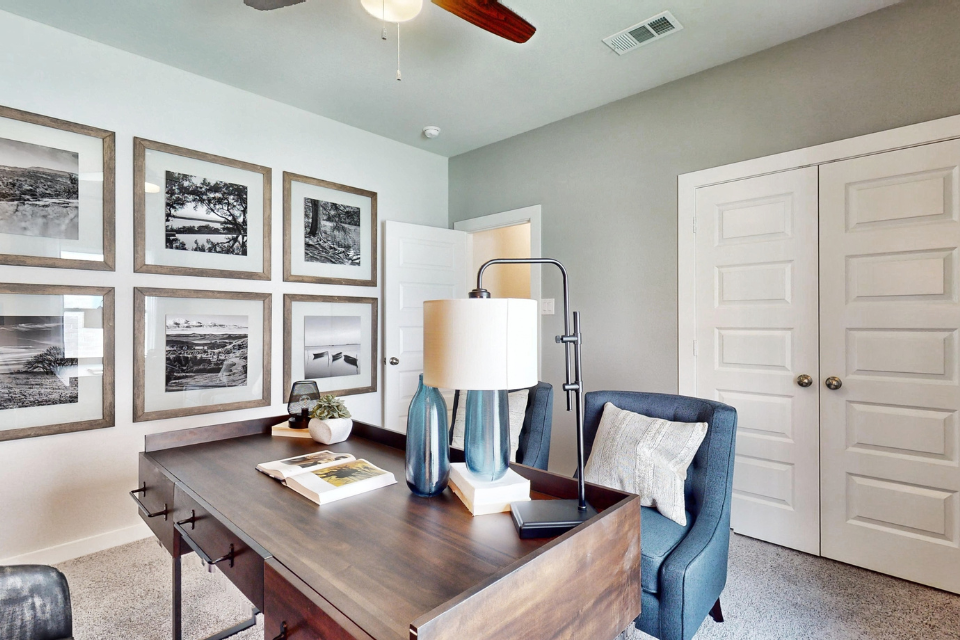 A room with a table and chairs.