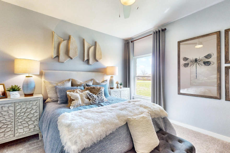 A bedroom with a large bed.