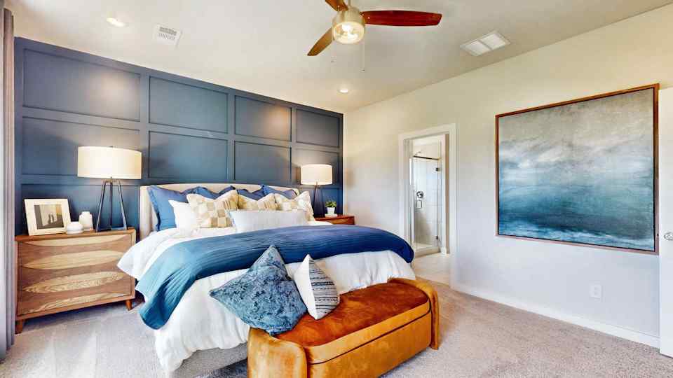 A bedroom with a large bed.