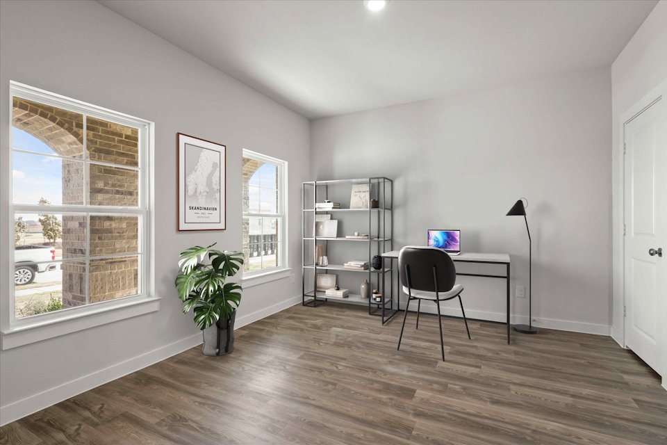 A room with a desk and a chair.