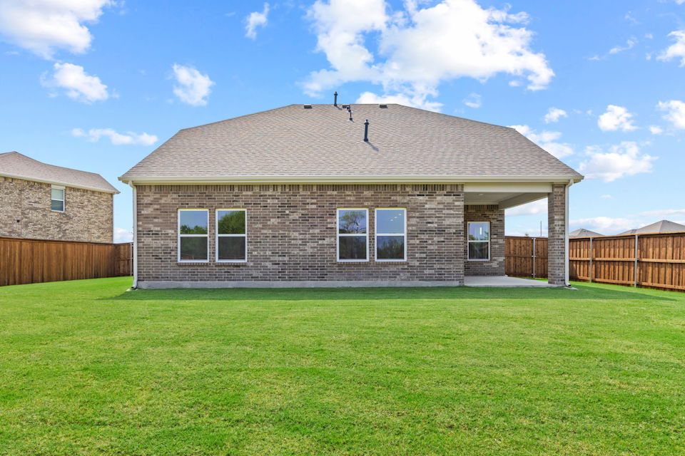 A house with a grass yard.