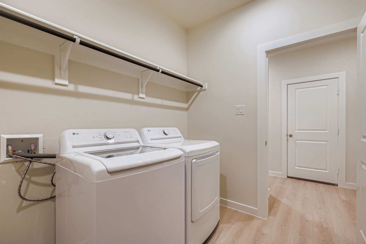 A white washing machine in a room.