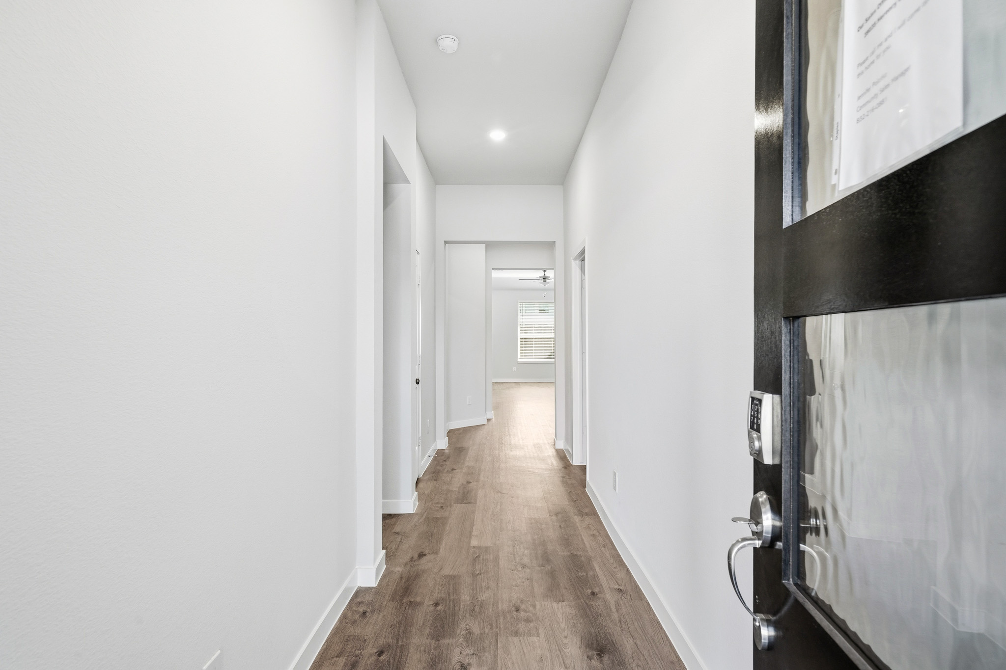 A hallway with white walls.