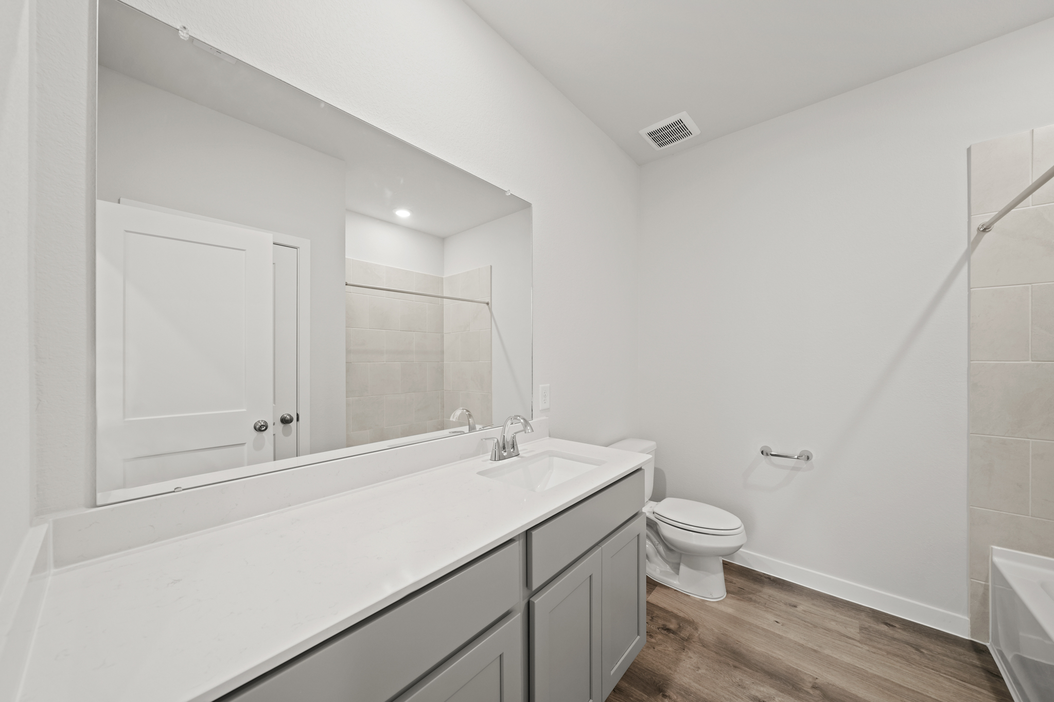 A bathroom with a glass shower.
