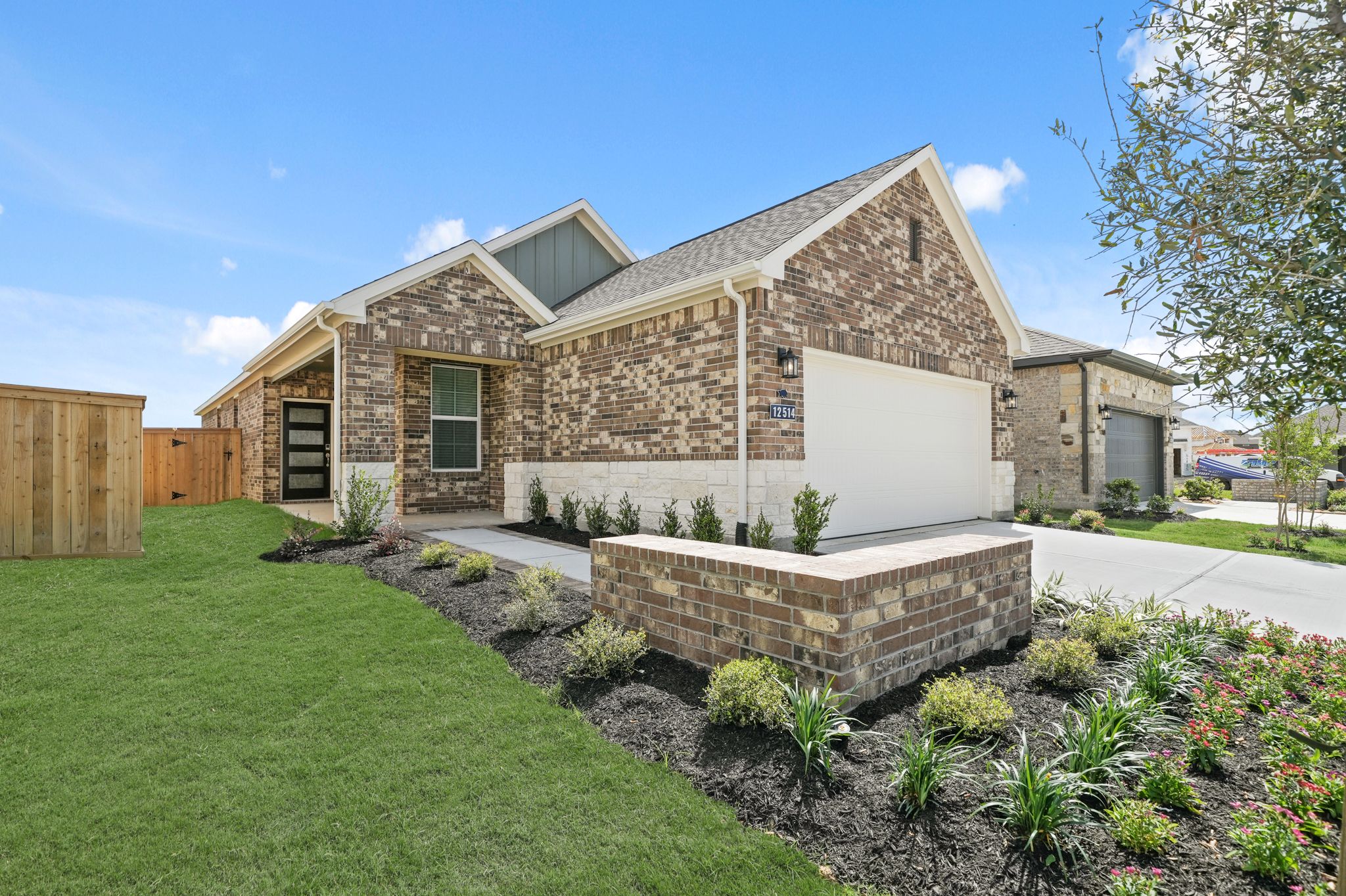 A house with a brick wall and a brick wall.