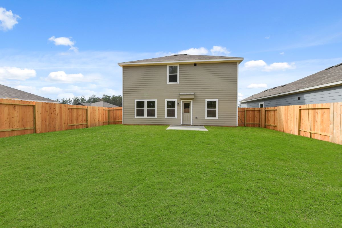 A house with a green lawn.