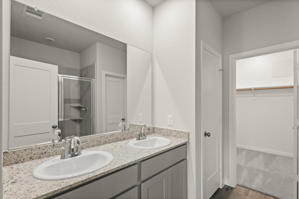 A bathroom with two sinks.