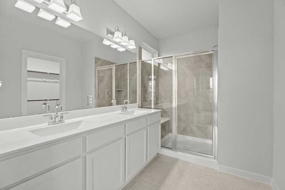 A bathroom with a glass shower.