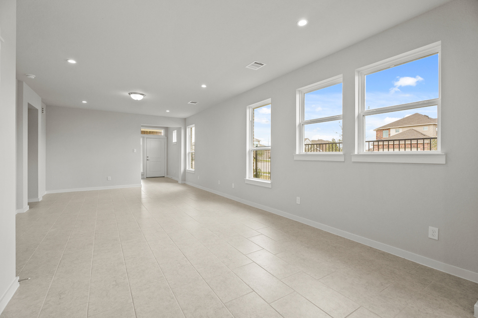 A large white room with a large window.