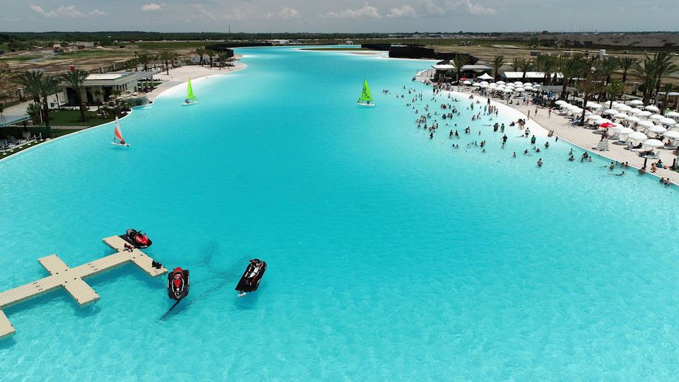 A body of water with boats and people on it.