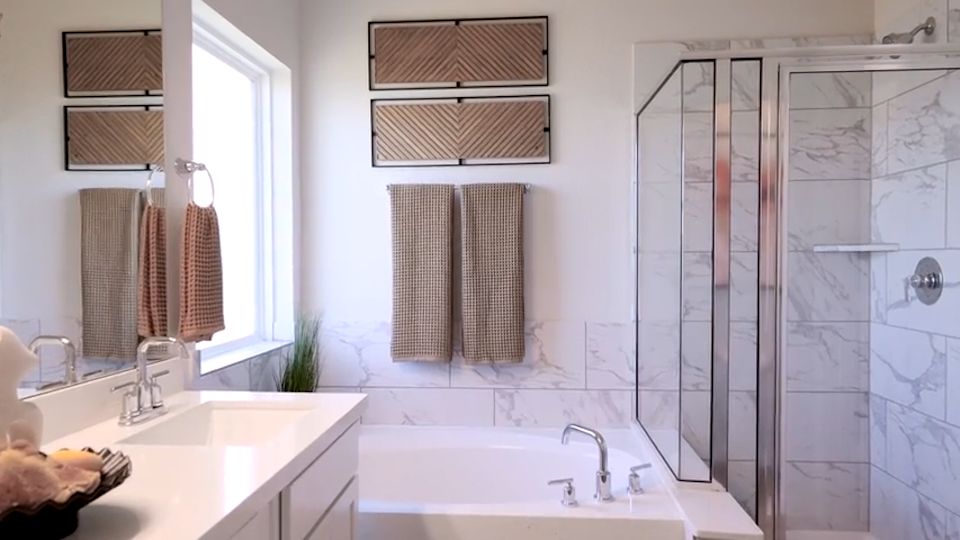 A bathroom with a glass shower.