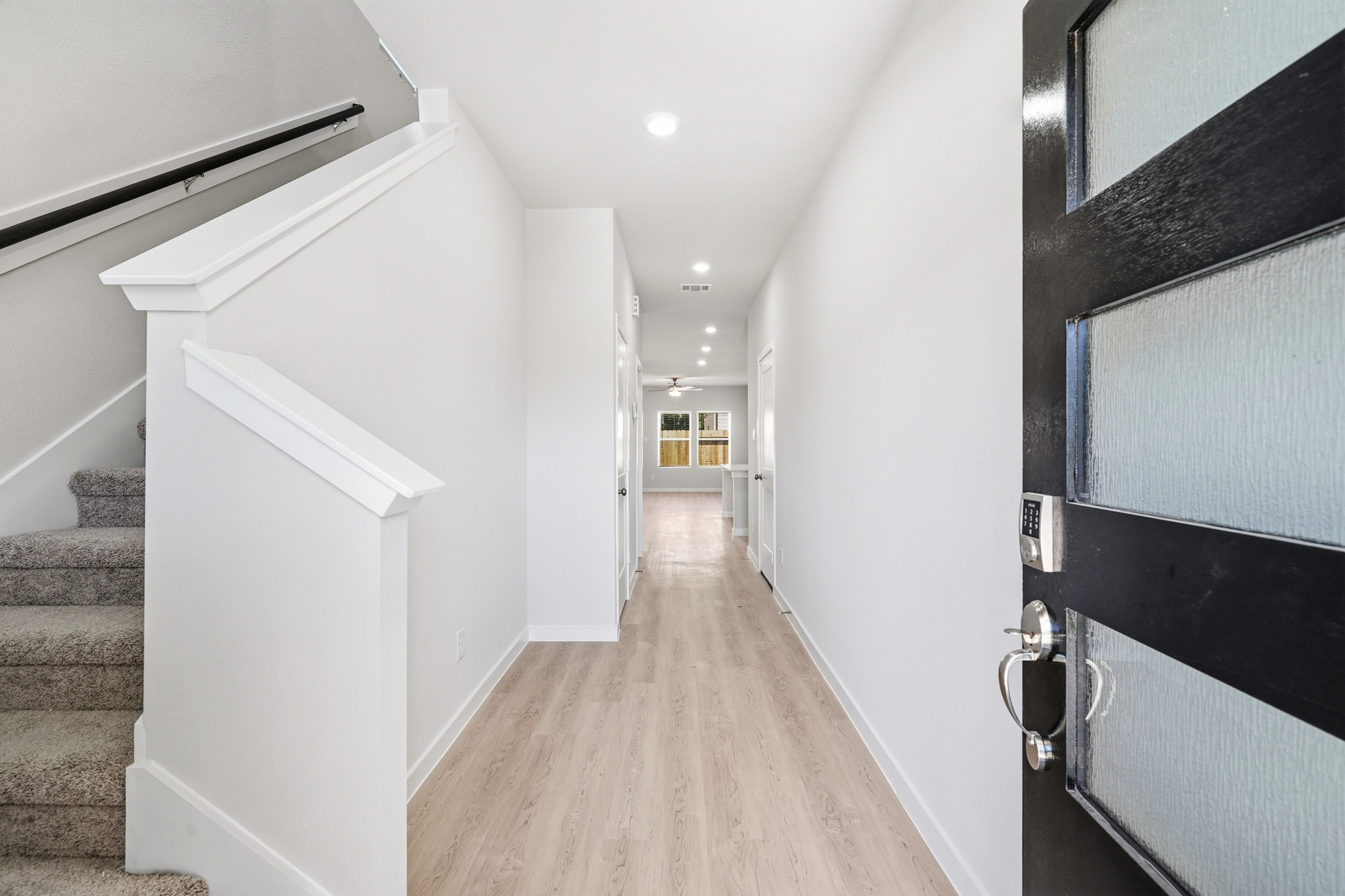 A hallway with black walls.