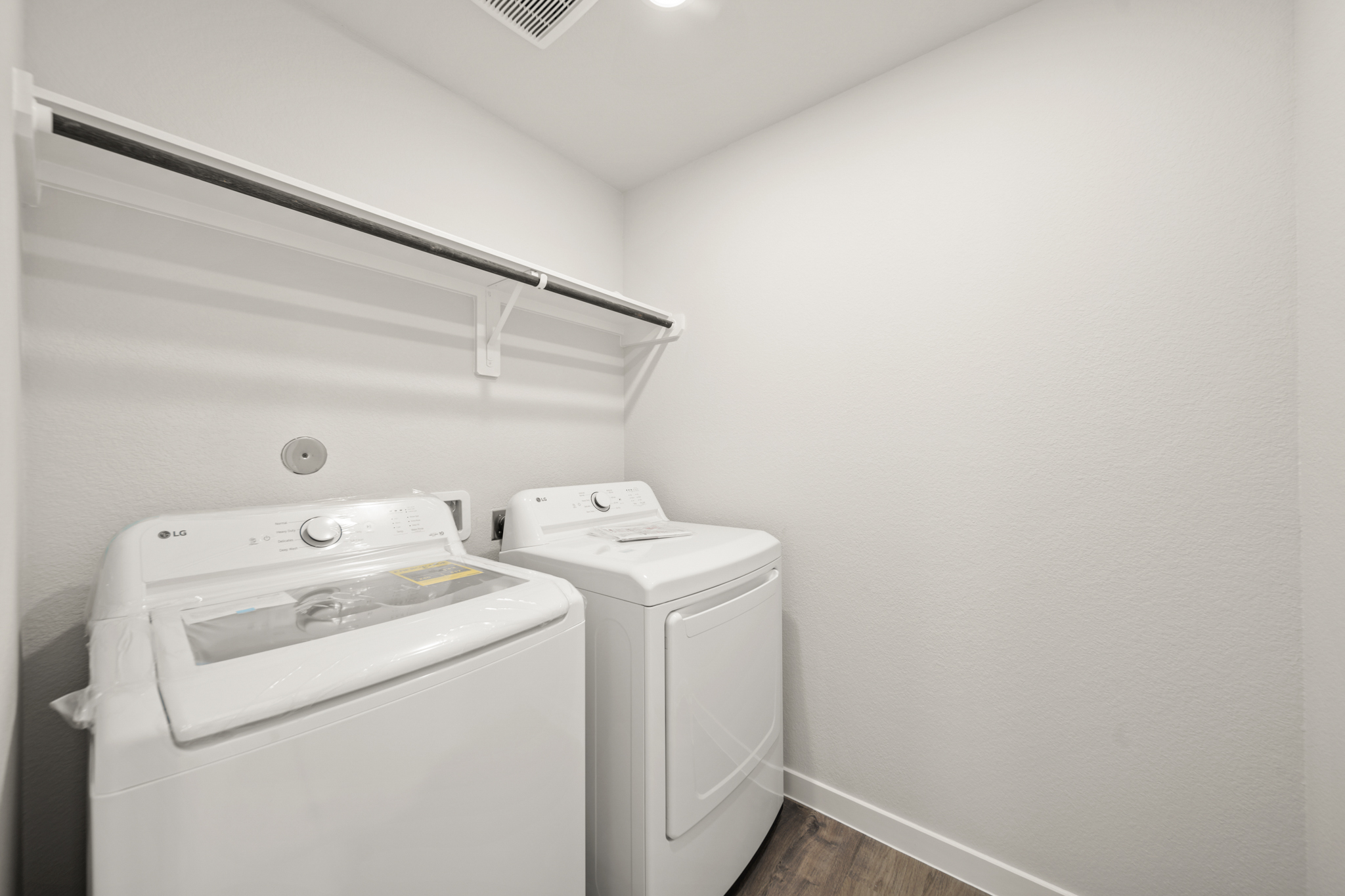 A washing machine in a room.