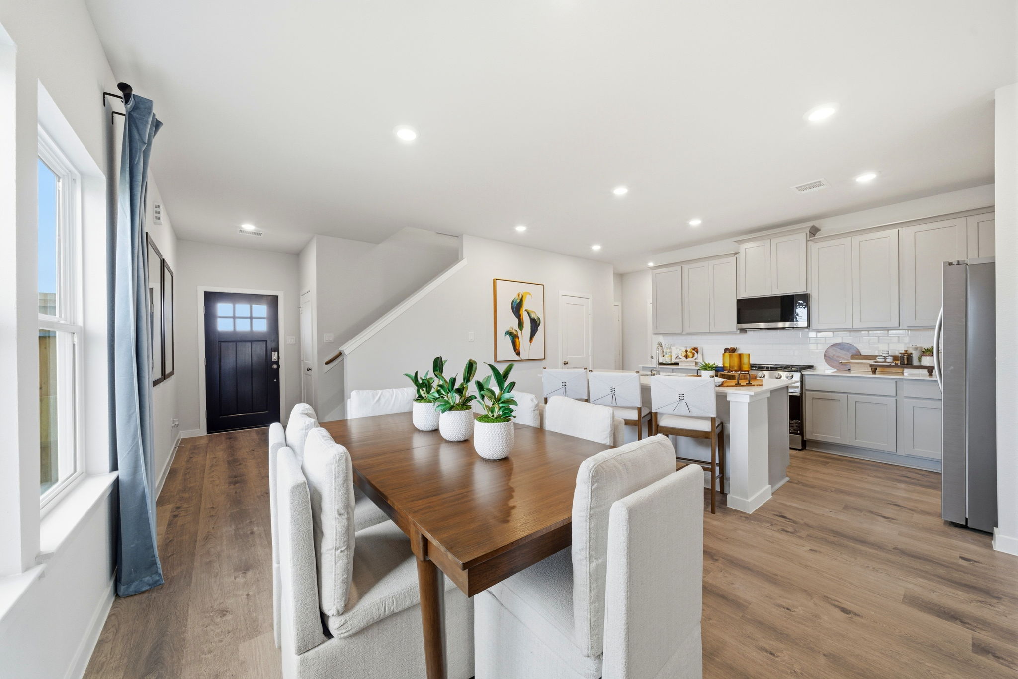 A kitchen with a dining table.