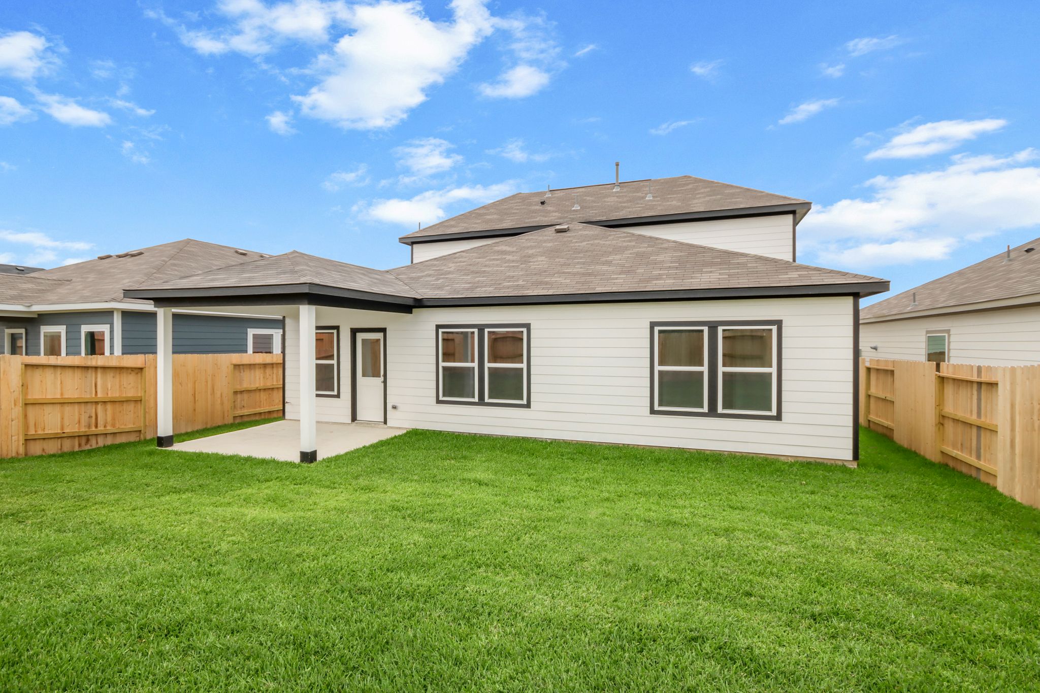 A house with a grass yard.