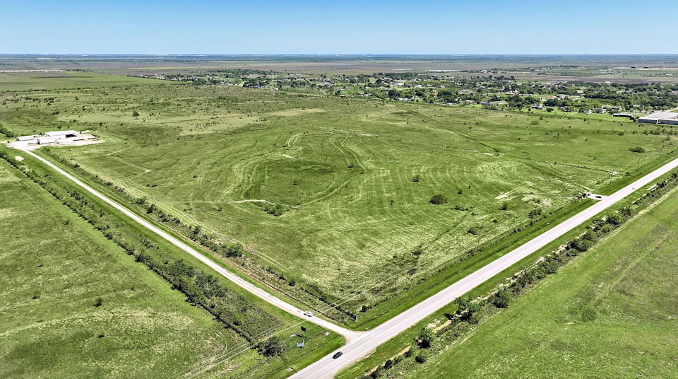 A road going through a field.