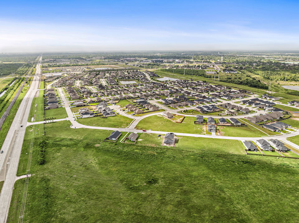 A landscape with buildings and grass.