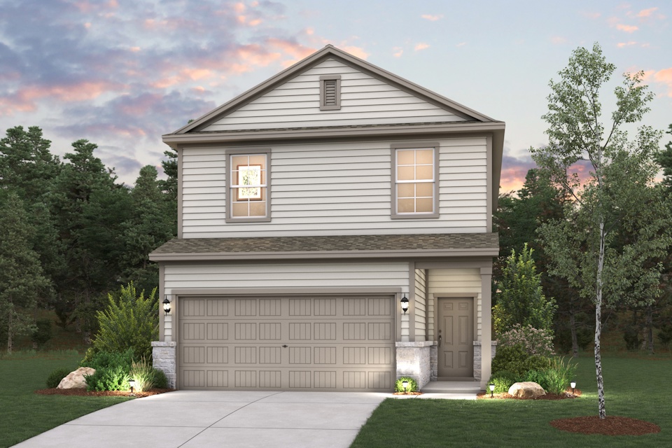 A house with a garage and trees around it.