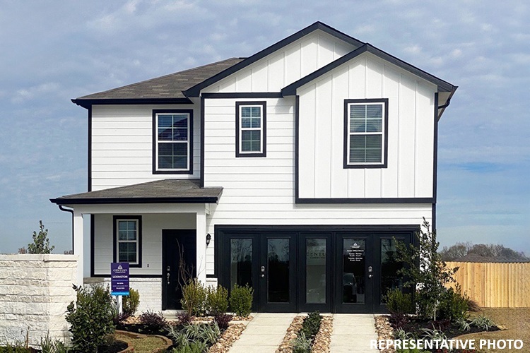 A house with a fence and a sign in front of it.