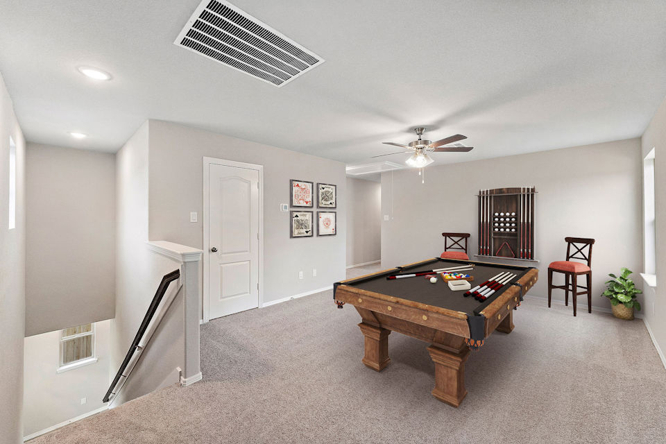 A room with a table and chairs.