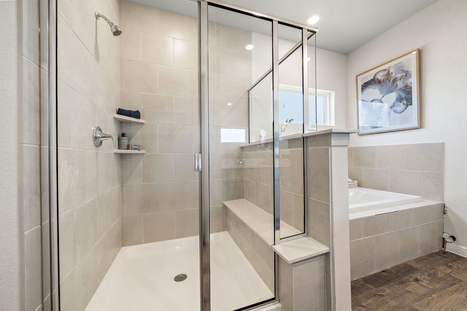 A bathroom with a glass shower.