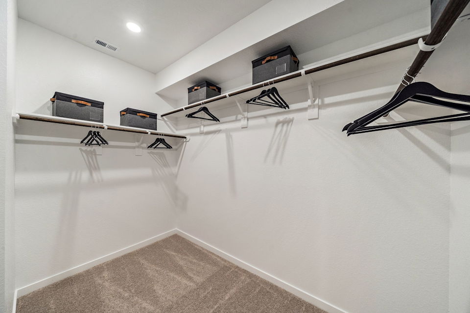 A white wall with a few black and white objects on it.