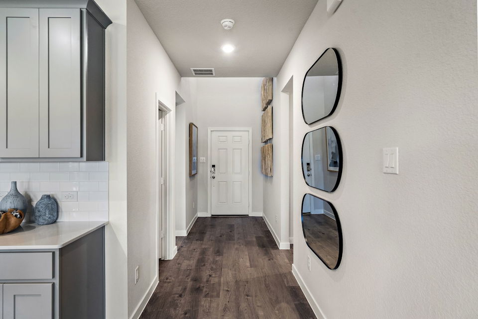 A bathroom with a mirror and sinks.