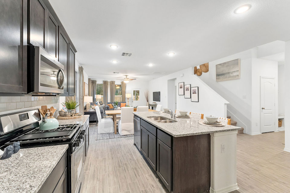 A kitchen with a wood floor.